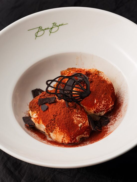 Tiramisu served in a shallow bowl