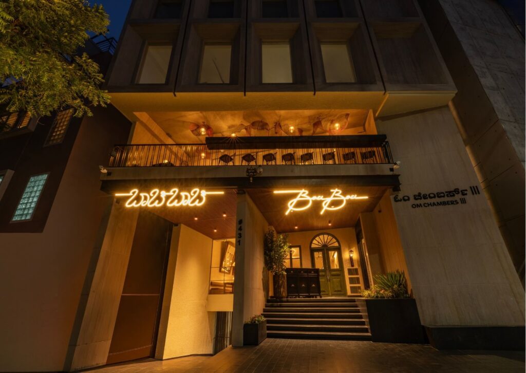 The restaurant frontage lit up in the evening