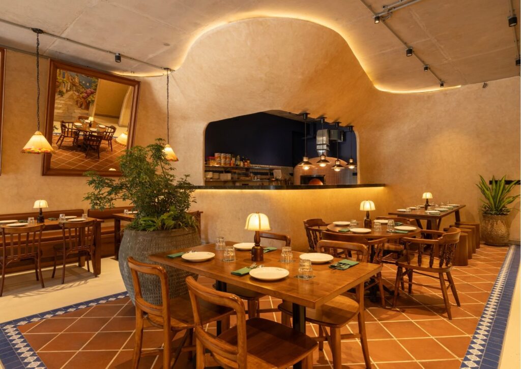 Curved lime-plastered walls and terracotta floors
