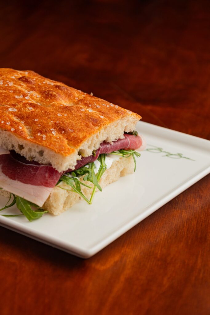 A schiacciata flatbread sandwich with Prosciutto di Parma