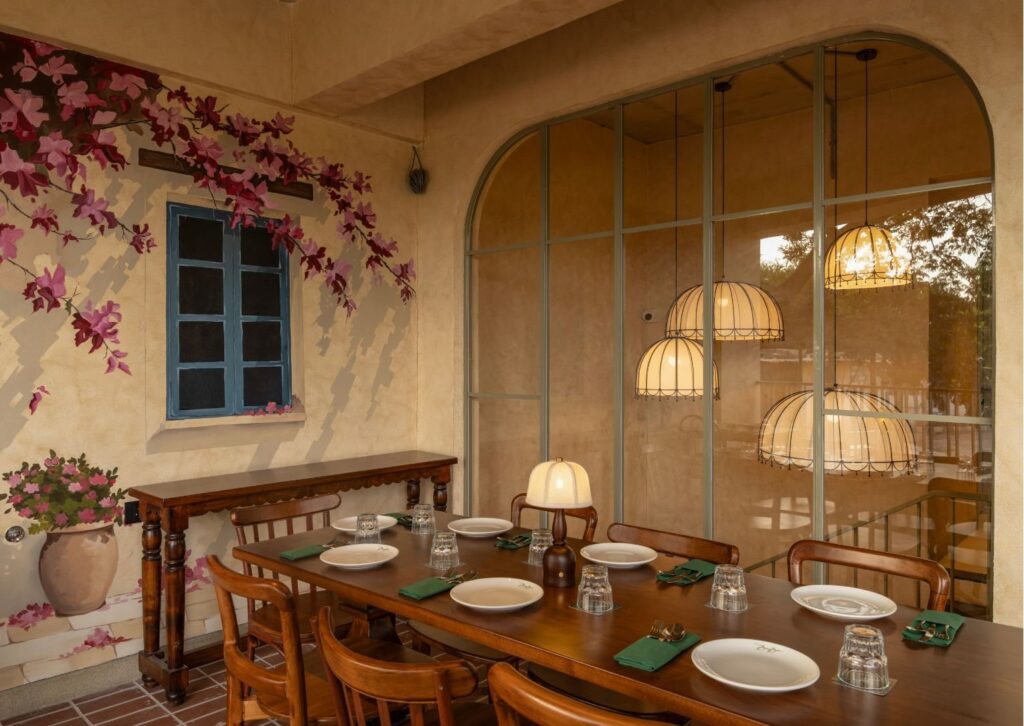 Terrace tables under bougainvillea