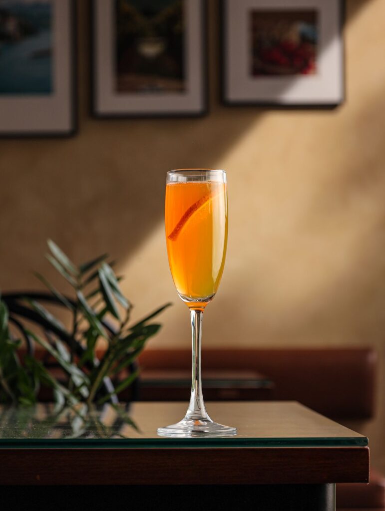 A peach Bellini in a flute
