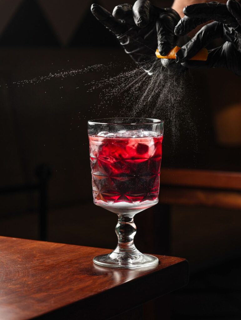 A berry cocktail finished with a spritz of aroma