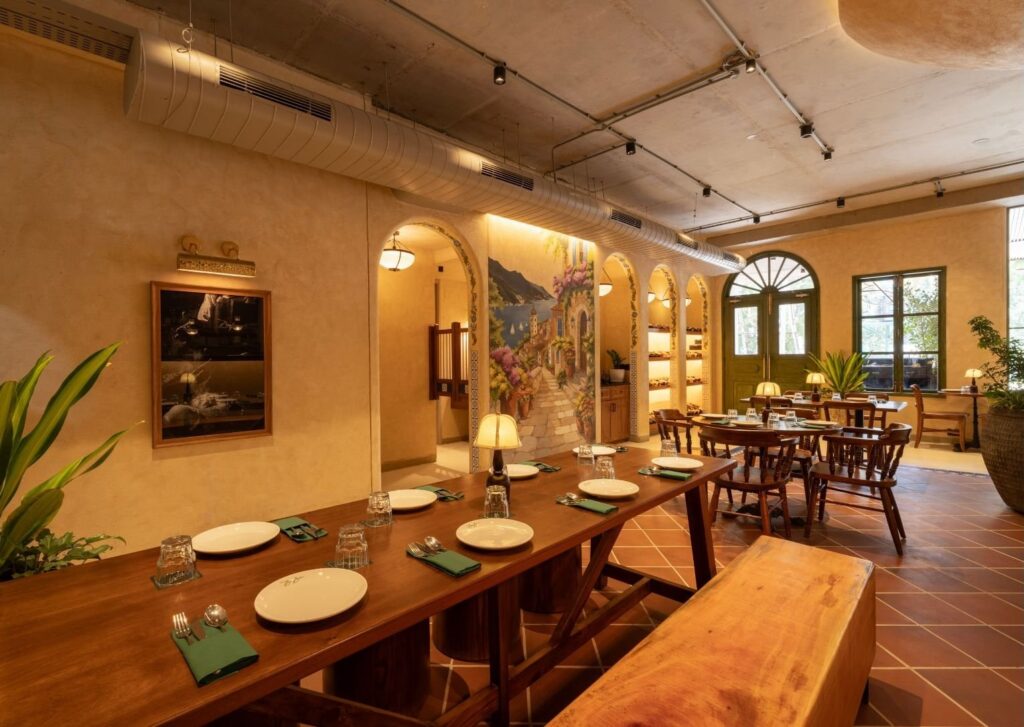 A long communal table laid for service