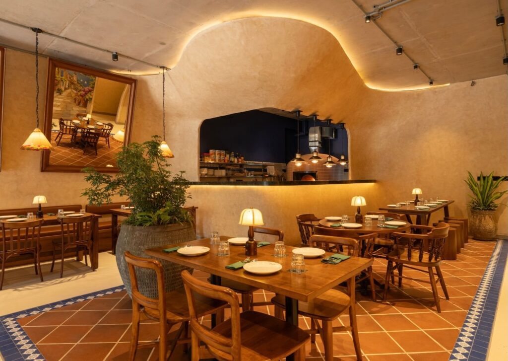 Curved lime-plastered walls and terracotta floors
