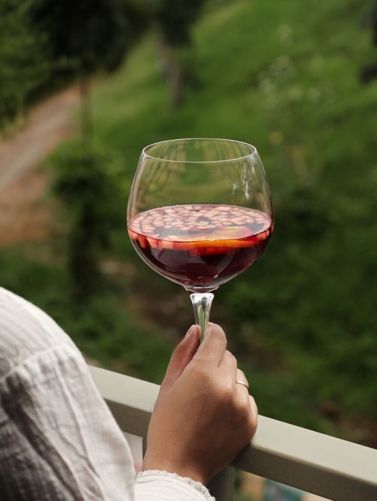 Sangria held up over the terrace greenery